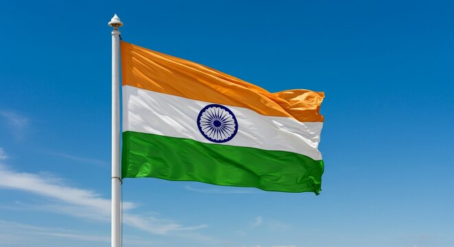  Waving Indian national flag with blue sky background