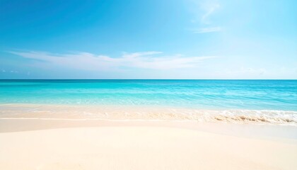 Obraz premium Soft-focus beach scene; tranquil turquoise water lapping a white sandy shore under a bright blue sky