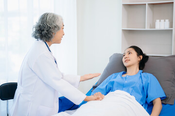 Fototapeta premium Senior doctor performing a medical checkup on a patient. Perfect for healthcare, medical, caregiving
