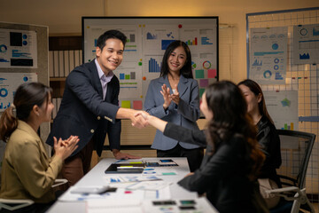 A group of people are in a meeting room