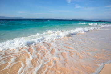 Waves Crashing on the Shore of a Tropical Beach