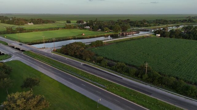miles of sugar cane fields just south of Lake Okeechobee and the water management levee and pump station providing life-giving water to the crop and farmers to the south