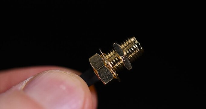 hold in your hand a piece of acoustic wire with a metal tip for connecting different equipment
