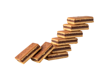 Stacked chocolate wafer cookies on black background