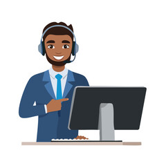 Smiling man with headset and computer at desk.