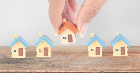 House Model there space Residential Structure in hand, home Business Concepts, and Success in Finance, Banking and Investment