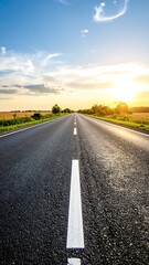 Fototapeta premium Asphalt road stretching to sunset