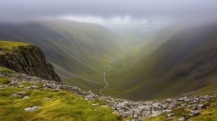 Mountain valley, mist, sunlight, rugged terrain