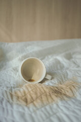 Coffee spill ruins morning bedding routine