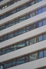 Reflections of urban architecture on a building facade