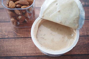 almond yogurt in a container on a table 