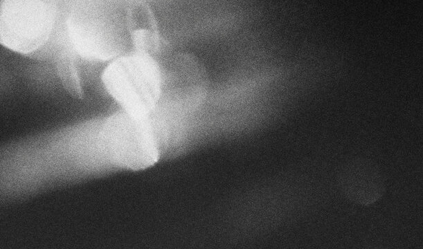 retro film overlay effect with scratch dust and light leaks, retro grain noisy film distressed texture light leak flare on black background, Black and white background