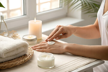 Woman Applying Moisturizing Cream on Hands During Spa Treatment at Home