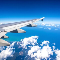 Airplane wing over a vast ocean and clouds