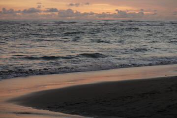 Orange Sunset with Soft Clouds over the Ocean