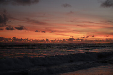 Orange Sunset with Soft Clouds over the Ocean