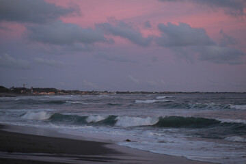 Pink Sunset with Soft Clouds over the Ocean