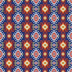 Ikat fabric Multicolored on a blue background abstract symbol