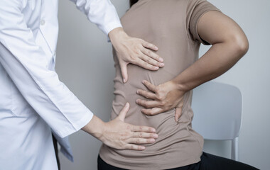 Female patients consulted physiotherapists with Low back pain for examination and treatment. Rehabilitation physiotherapy concept