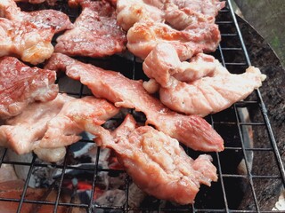Pork grilled on a charcoal grill