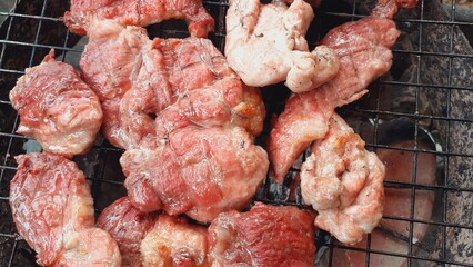 Pork grilled on a charcoal grill