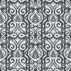 Ikat fabricWhite on grey background abstract symbol