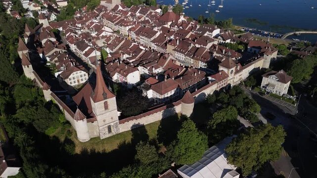 Morat town Switzerland Murten lake Swiss village municipality aerial drone establish shot