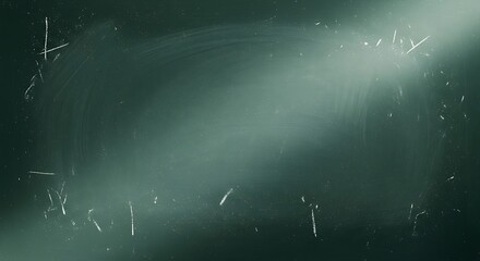 A dark green chalkboard with white chalk marks smudges and dust
