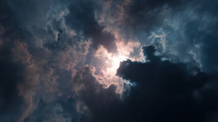 Sun breaking through dark clouds