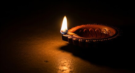 Clay oil lamp with flickering flame clay lamp diya