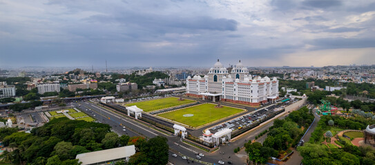 Aerial view of Telangana state Secretariat building in Hyderabad city in India during evening time on a cloudy day.