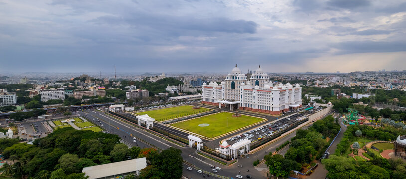 Aerial view of Telangana state Secretariat building in Hyderabad city in India during evening time on a cloudy day.