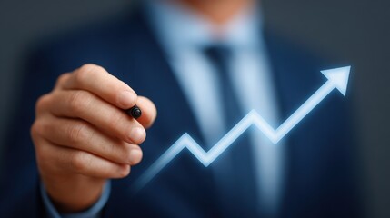A man in a suit is drawing a line with a marker that looks like an arrow