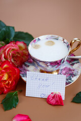 Morning break, roses decorate a card with gratitude