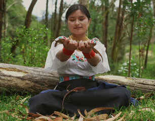 Indigenous woman crafting with natural materials in lush forest