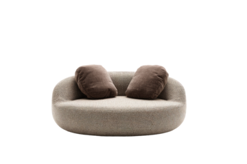Rounded, light beige sofa with dark brown bolster pillows