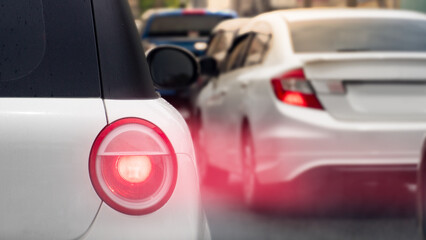 Speed light of white car on the road. with many car driving on the road.