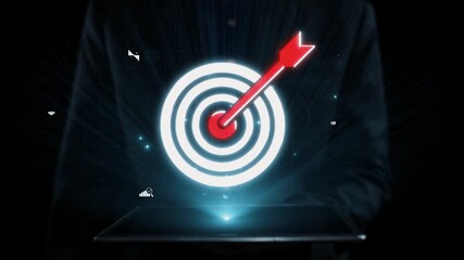 A businessman interacts with a digital tablet, showcasing a target symbol with data visuals. This image represents modern strategies for achieving business goals and success. Qubit
