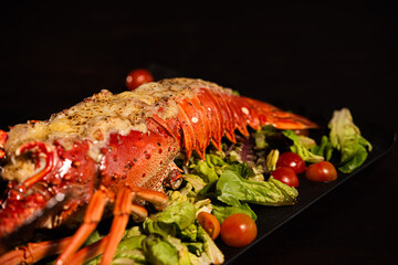 Grilled Lobster Served on Fresh Salad with Gourmet Sides