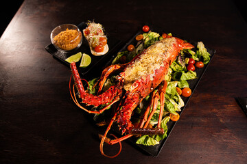 Grilled Lobster Served on Fresh Salad with Gourmet Sides