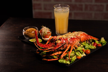 Grilled Lobster Served on Fresh Salad with Gourmet Sides