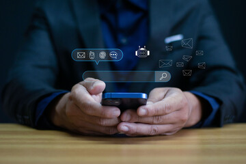 AI chatbot, a businessman using a smartphone, is a symbol of intelligent customer support,...