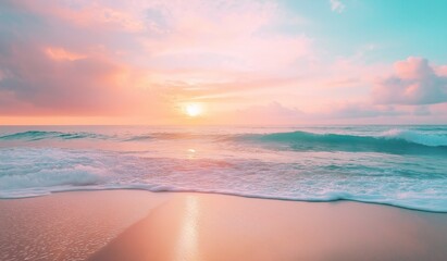 Obraz premium Beautiful pastel pink and blue sunset over the ocean with soft waves on sandy beach creating a tranquil summer tropical paradise scene