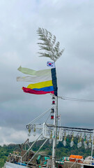 Korean flag and five-colored flag hanging fishing boat