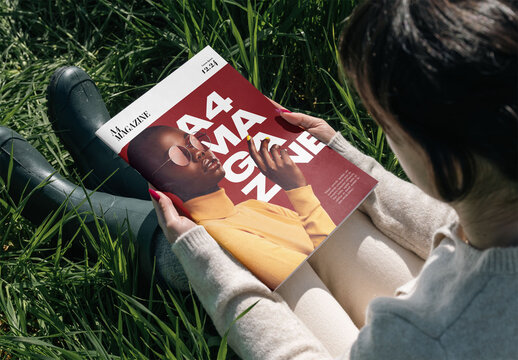 Mockup Of Woman Reading Customized A4 Magazine On Grass