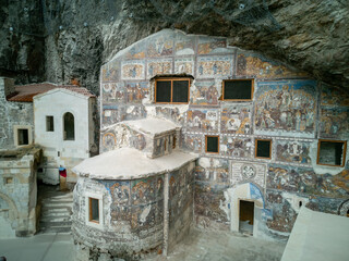 Ancient Rock Monastery with Colorful Frescoes and Historic Architecture