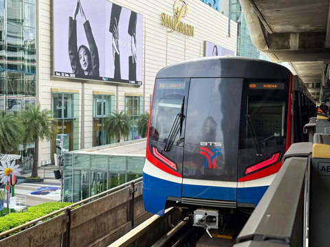 Bangkok, Thailand - June 22, 2025: Close-up of BTS Skytrain in front of Siam Paragon shopping mall