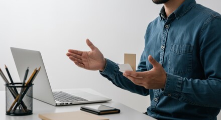 Man Presenting with Laptop and Hand Gestures Business Meeting.