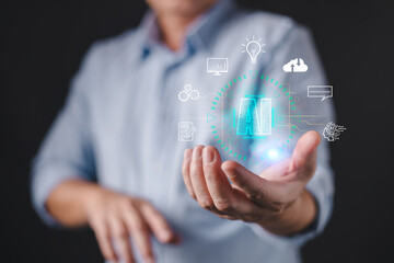 A person presents a glowing holographic interface featuring the letters AI surrounded by icons representing innovation, data, cloud, command, and technology, artificial intelligence concepts.
