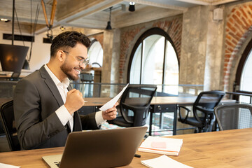 Young manager looking excited after receiving a good news